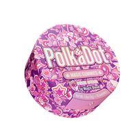 A round container of Polka Dot Magic Gummies Pink Spice 5g Magic Blend, featuring a vibrant pink and purple patterned lid with the brand name 'Polka Dot' in large white letters.