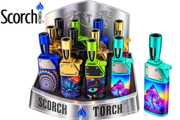 A display of Scorch Torch lighters in multiple vibrant colors and patterns, including blue, green, gold, and psychedelic designs, shown on a white background with the Scorch Torch logo.
