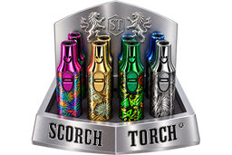 Four metallic disposable vape devices displayed in a silver branded retail stand. The devices feature colorful patterns and metallic finishes in pink, gold, green, and silver, with the SCORCH TORCH branding visible on the stand.