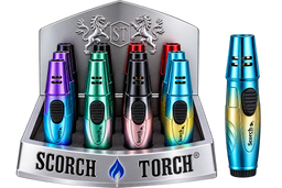 A display of Scorch Torch lighter matches in multiple metallic colors, including purple, green, black, pink, and blue, shown inside a branded silver display stand with a single lighter standing beside it on a white background.