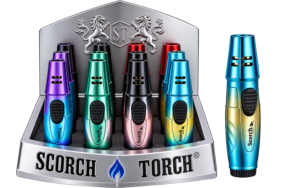 A display of Scorch Torch lighter matches in multiple metallic colors, including purple, green, black, pink, and blue, shown inside a branded silver display stand with a single lighter standing beside it on a white background.